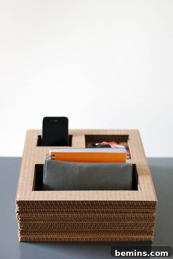 A black table has a wooden box with wallets in it.
