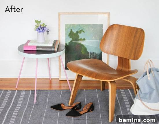 A wooden chair by a portrait and an end table. After the colorful makeover.
