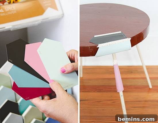 Paint samples in varying hues alongside a small skinny legged table.
