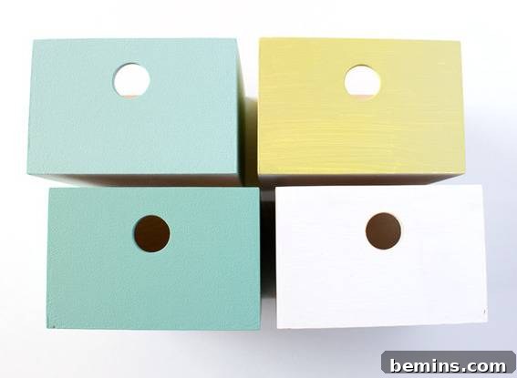 Drawers painted in various shades of blue, white, and yellow