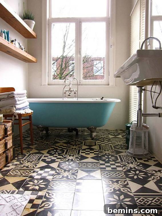 Eye-Catching Floors: 14 Stylish Bathrooms with Patterned Tile 11 Eclectic bathroom with mismatched tiles and teal clawfoot bathtub