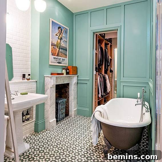 Eye-Catching Floors: 14 Stylish Bathrooms with Patterned Tile 15 Bathroom with a round tub and teal cabinets, featuring patterned floor tiles