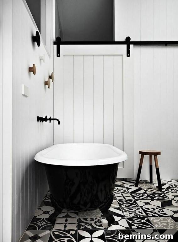 Eye-Catching Floors: 14 Stylish Bathrooms with Patterned Tile 3 Elegant black and white bathroom with patterned floor tiles