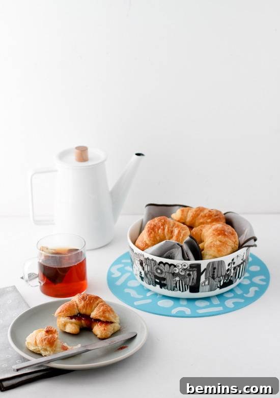Croissant, tea, and a trivet with croissants.