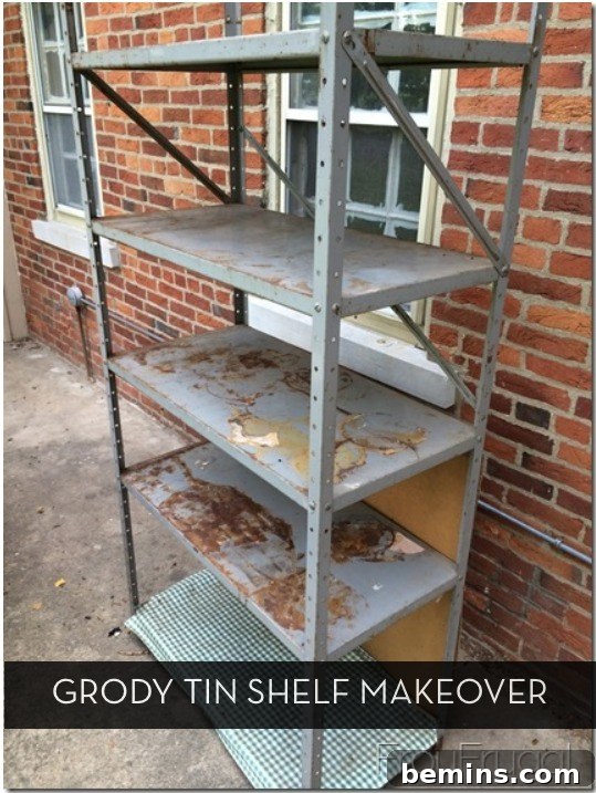 From Rusty Relic to Rustic Chic: A Shelf's Transformation 2 Rusted tin shelf with five levels sits outside a brick building.