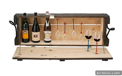 Bottles of wine and wine glasses arranged in a repurposed ammo box.