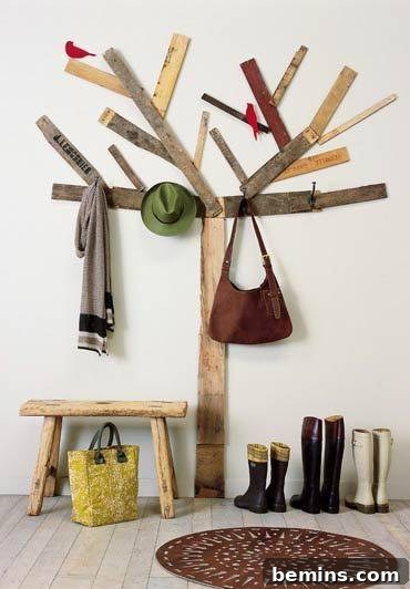 Unique coat rack resembling a tree, crafted from scrap wood.