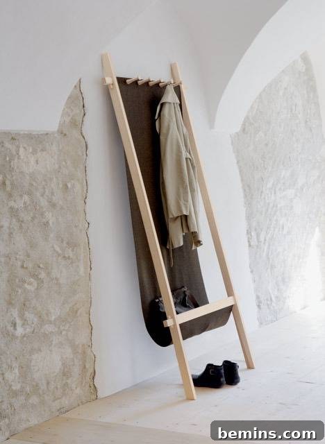 Elegant ladder coat rack adorned with clothing.