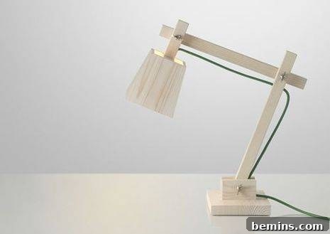 Wooden desk lamp with a green cord, adding a pop of color.