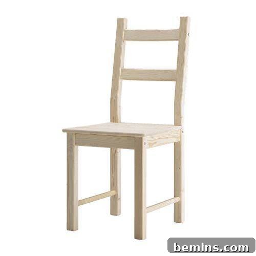 A light brown wooden chair has square edges.