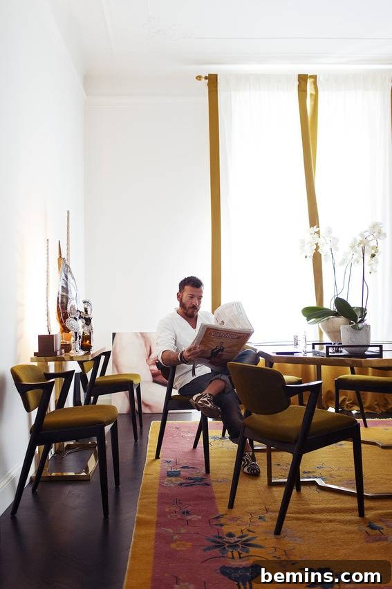 A person comfortably seated in a chair, absorbed in reading a newspaper, capturing a moment of relaxed contemplation.
