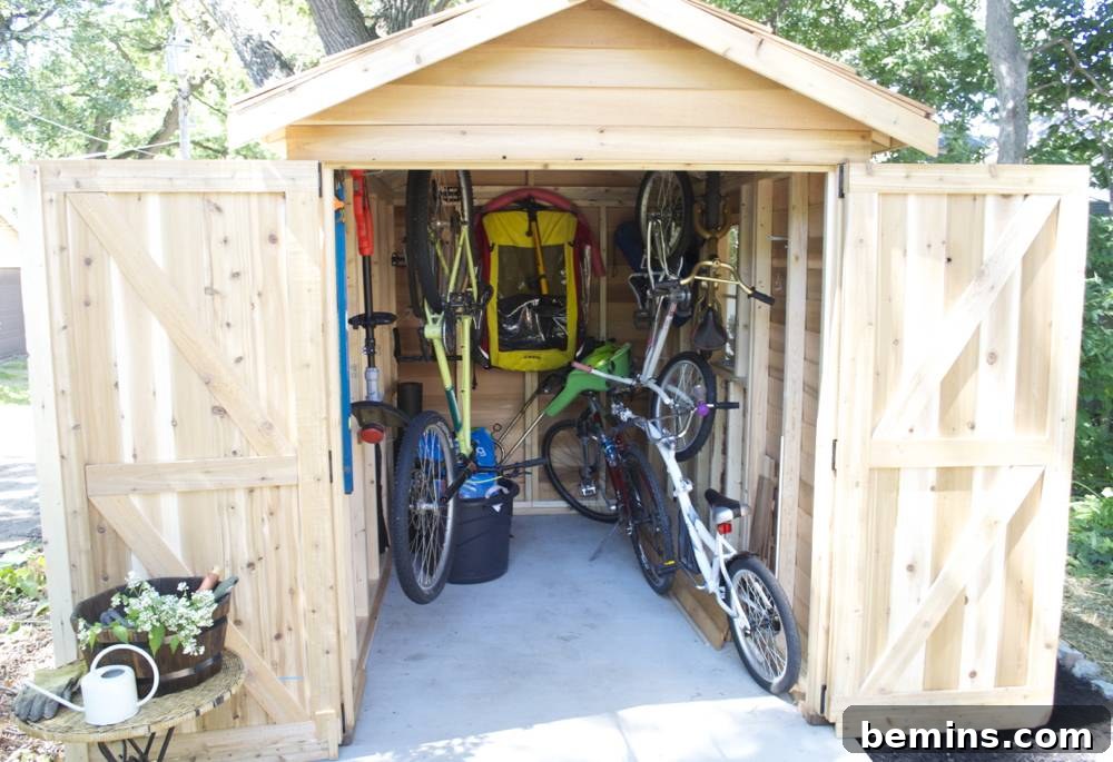 Bikes and gear organized inside a wooden shed: Demonstrating the increased storage capacity and organization in the backyard.