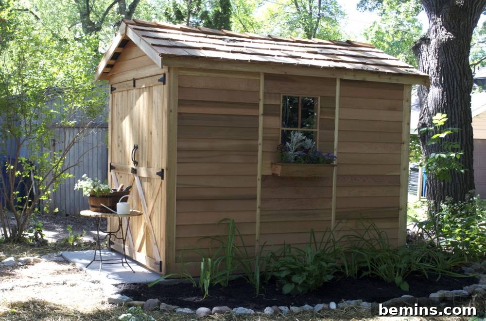 A new wooden shed with flower bed: Showcasing the completed backyard makeover with garden shed and landscaping.