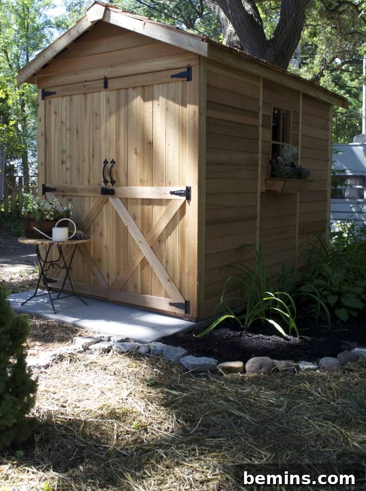 A light brown shed in the shade: Highlighting the natural cedar finish of the new backyard shed.