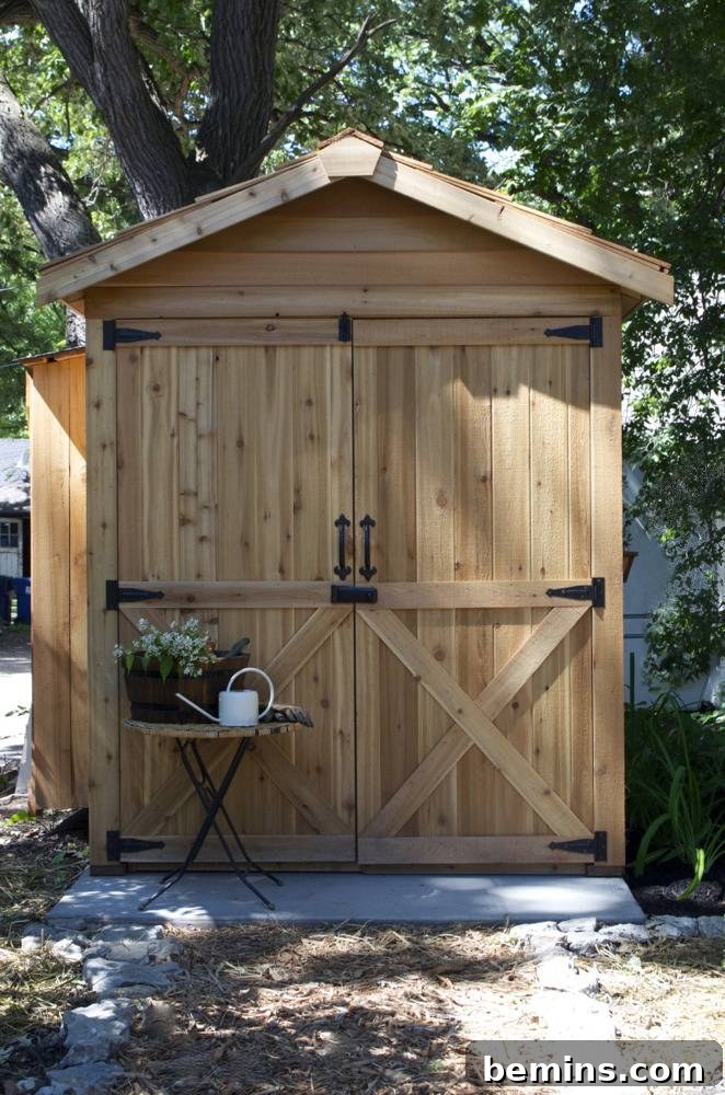 Refreshed Retreat: A Garden Shed and Backyard Transformation 10 A wooden shed in the shadow of a large tree: Emphasizing the harmonious integration of the shed into the backyard landscape.