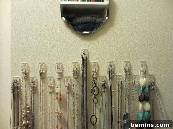A list of necklaces in a white wall
