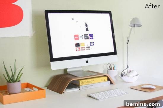 Desk Makeover: 6 Steps to a Stylish and Organized Workspace 3 An iMac on a stylish computer desk with decorations, ornaments, and a lamp.