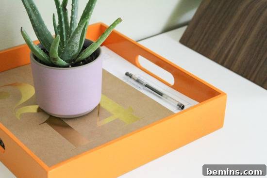 Desk Makeover: 6 Steps to a Stylish and Organized Workspace 6 Succulent in clay pot inside an orange square tray.