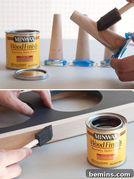 Applying finish to the table legs.