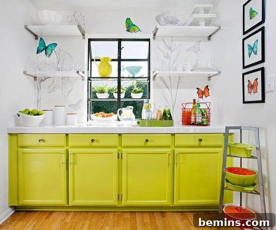 A kitchen with butterfly art and yellow cabinets.