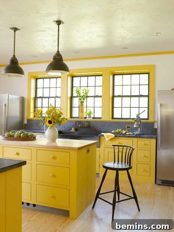 A modern kitchen has a yellow color scheme.