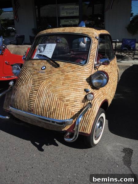 Corked Cruisin': The Ultimate Wine Cork Car 4 A small antique car completely covered in wine corks, showing the stunning transformation.