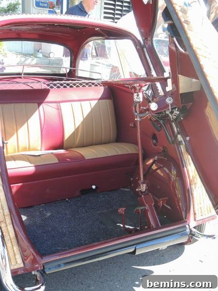 Corked Cruisin': The Ultimate Wine Cork Car 5 The back hatch of a vehicle is open to reveal tan and red seats.