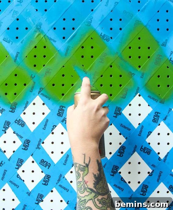 Applying spray paint to create vibrant and eye-catching patterns