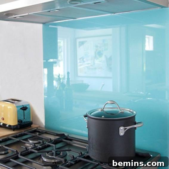 A pot sits on the stove with a backsplash behind it.
