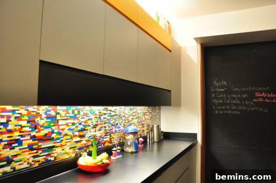 A colorful backsplash lines the back of a counter under a cabinet.