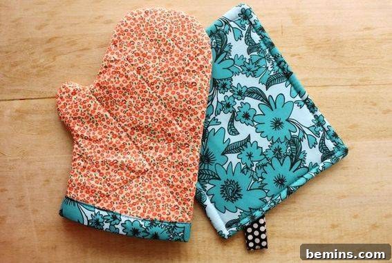 Culinary Creations: 16 Fabric DIY Projects for Home Chefs 11 An orange and white oven mitt paired with a matching blue pot holder, demonstrating a stylish and functional kitchen set.