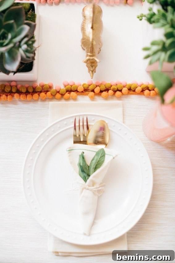 Culinary Creations: 16 Fabric DIY Projects for Home Chefs 4 A close-up of a gold fork and spoon resting on a white plate, showcasing a handmade pom pom placemat.