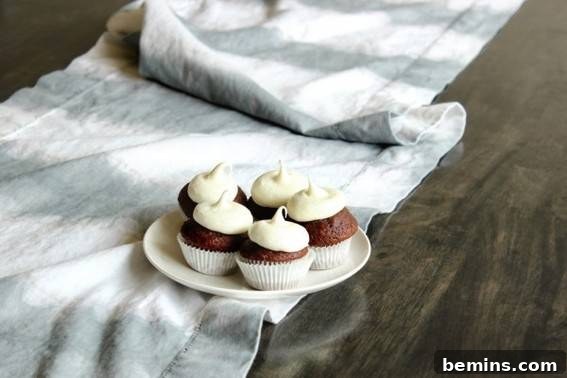 Culinary Creations: 16 Fabric DIY Projects for Home Chefs 8 Five cupcakes displayed on a table runner with a beautiful dip-dyed effect.