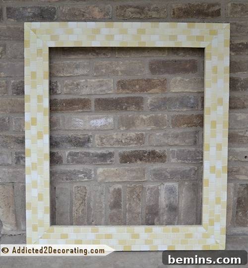 Mosaic tile frame around a bathroom mirror