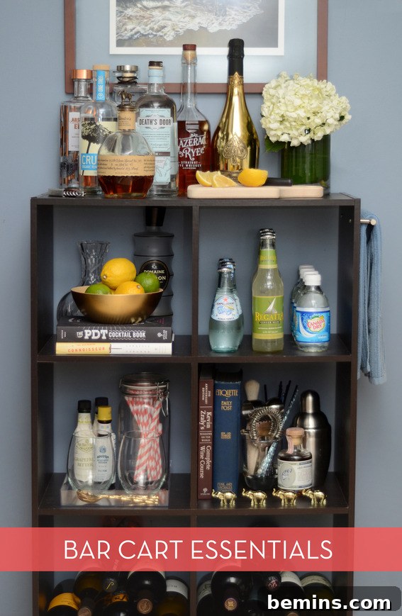 A beautifully arranged bar cart showcasing various liquors and glassware.