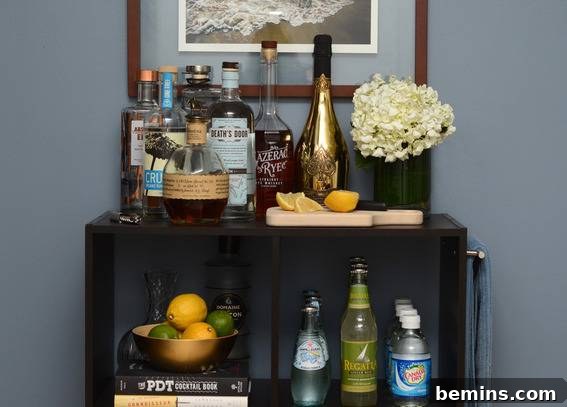 A well-organized bar cart featuring an assortment of liquors and mixers.