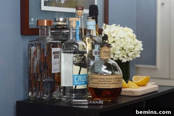A well-styled bar cart with a vase of flowers adding a decorative touch.
