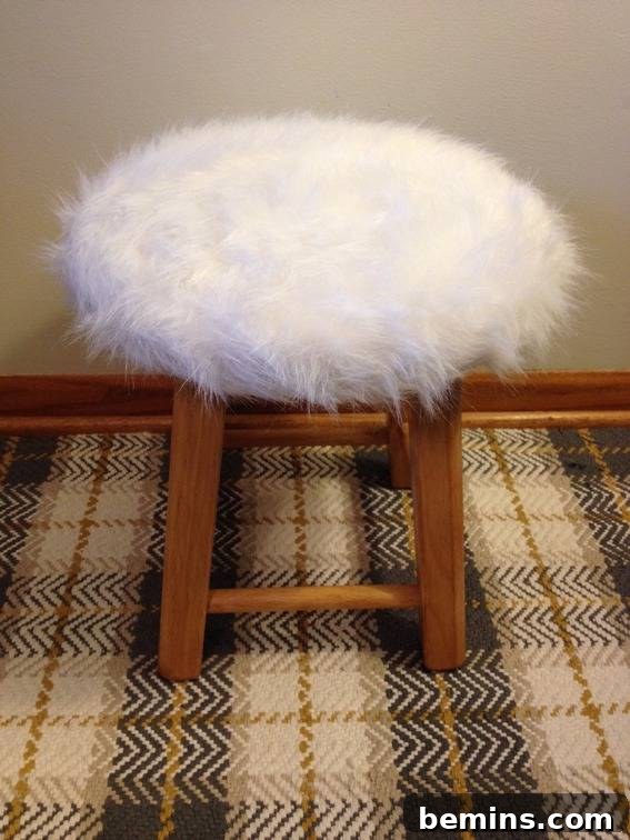 Double the Seating: A DIY Stool Split 16 Fuzzy white stool with brown legs. The finished cat stool with faux fur upholstery.