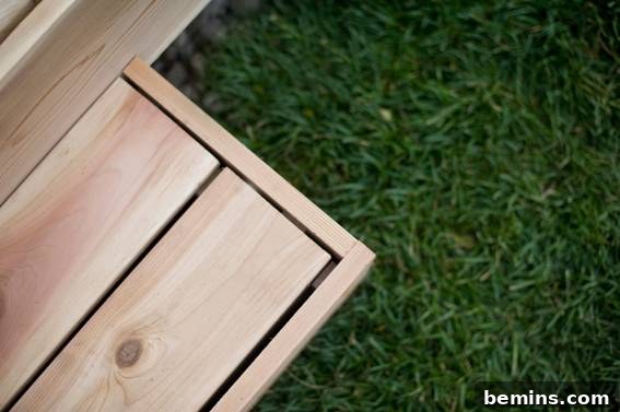 From Cluttered to Chic: A Backyard Deck Transformation 14 Wooden step leading onto the green grass.