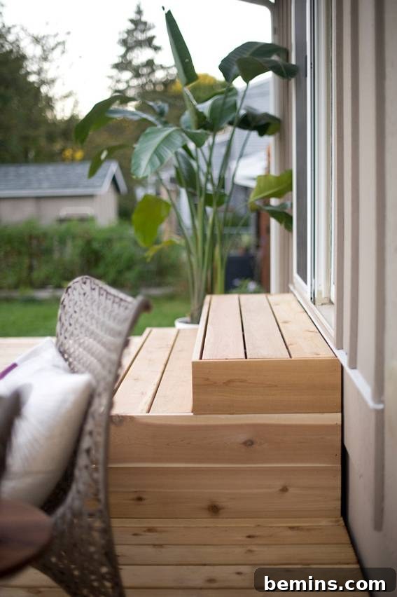 From Cluttered to Chic: A Backyard Deck Transformation 15 A pallet of wooden boards layered on top of each other in the backyard.