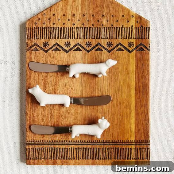 Three spreaders with dog-shaped handles.