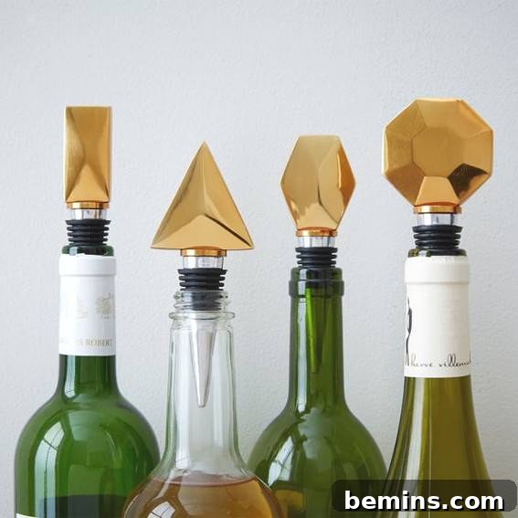 Four wine bottles with oddly shaped corks.