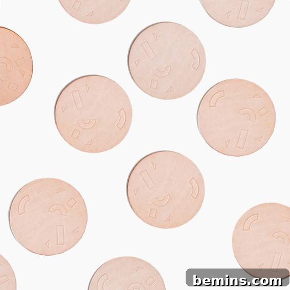 A white surface with pale pink dots.