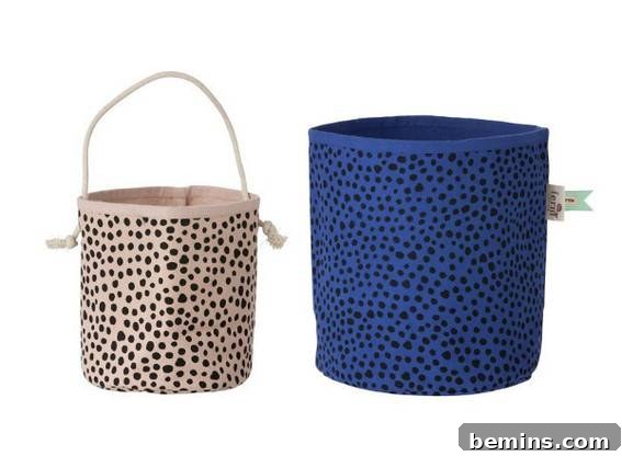 A small canvas basket sitting next to a larger blue one.