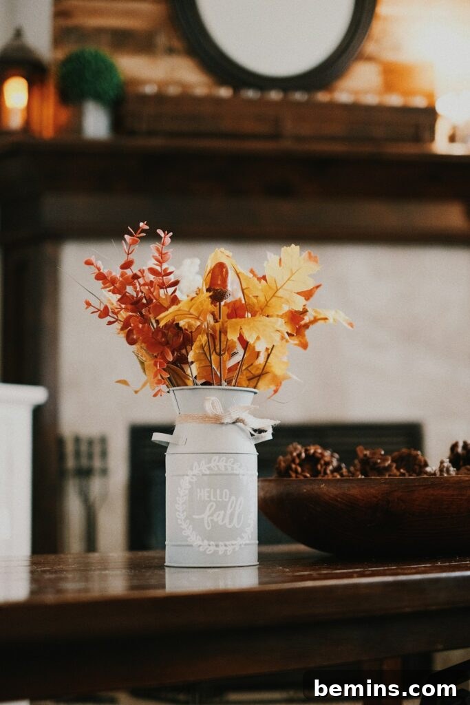 yellow and red flowers in white ceramic vase