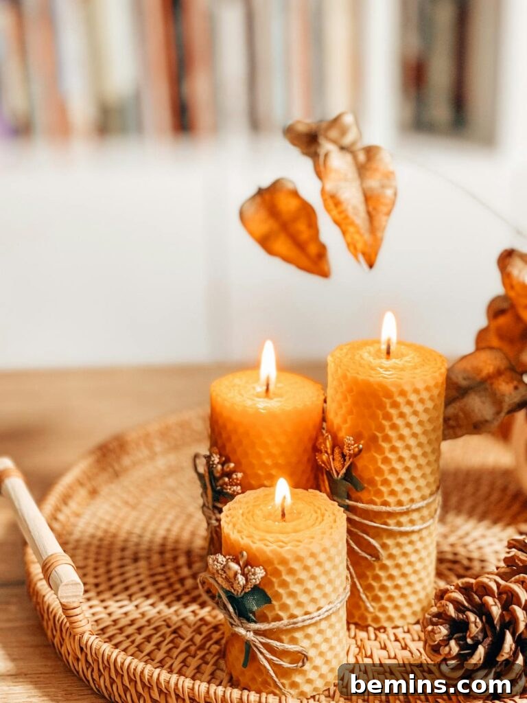 Warm autumn scene with handmade beeswax candles on a wicker tray, evoking a cozy atmosphere.