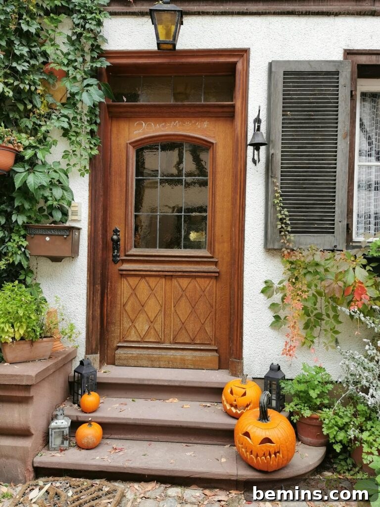 A warm, inviting porch decorated with Jack-o'-lanterns for Halloween in fall season.