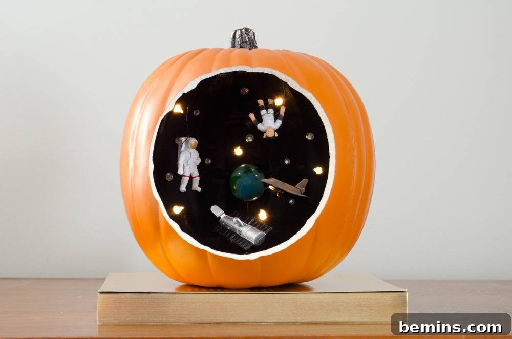 A pumpkins has a black round decoration on it with intricate details.