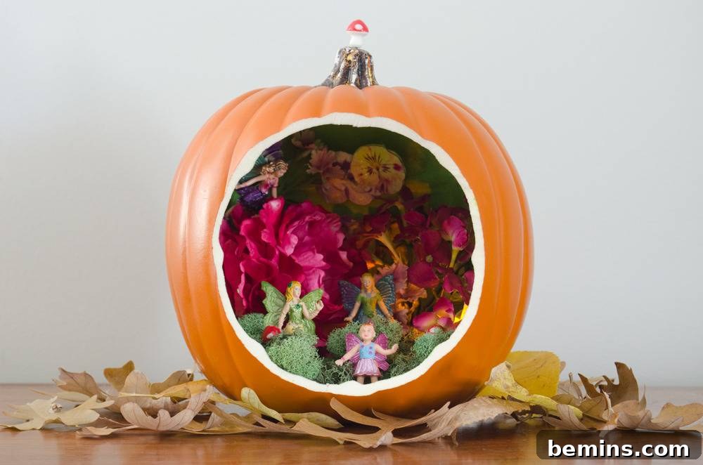 "Quirky pumpkin dioramas with flowers,dried leaves and dolls, showcasing a whimsical fairy garden scene."