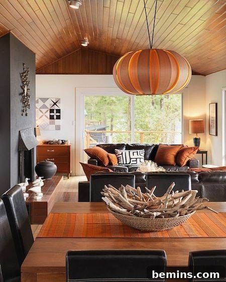 A table showcasing a large, eye-catching orange bowl-shaped lamp.